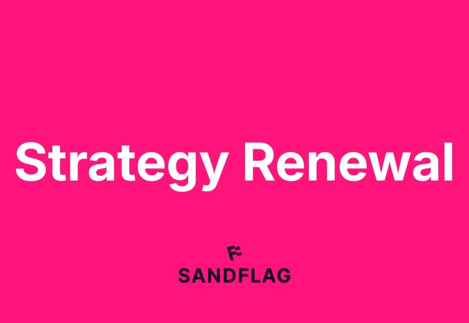 Text on a pink background: 'Strategy Renewal' with a logo below that says 'SANDFLAG' in black.
