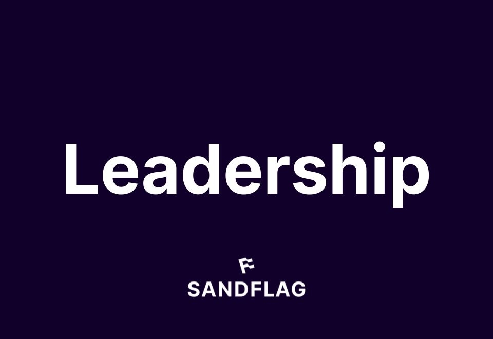 Text graphic featuring the word 'Leadership' in large white font on a dark purple background, with 'SANDFLAG' logo below.