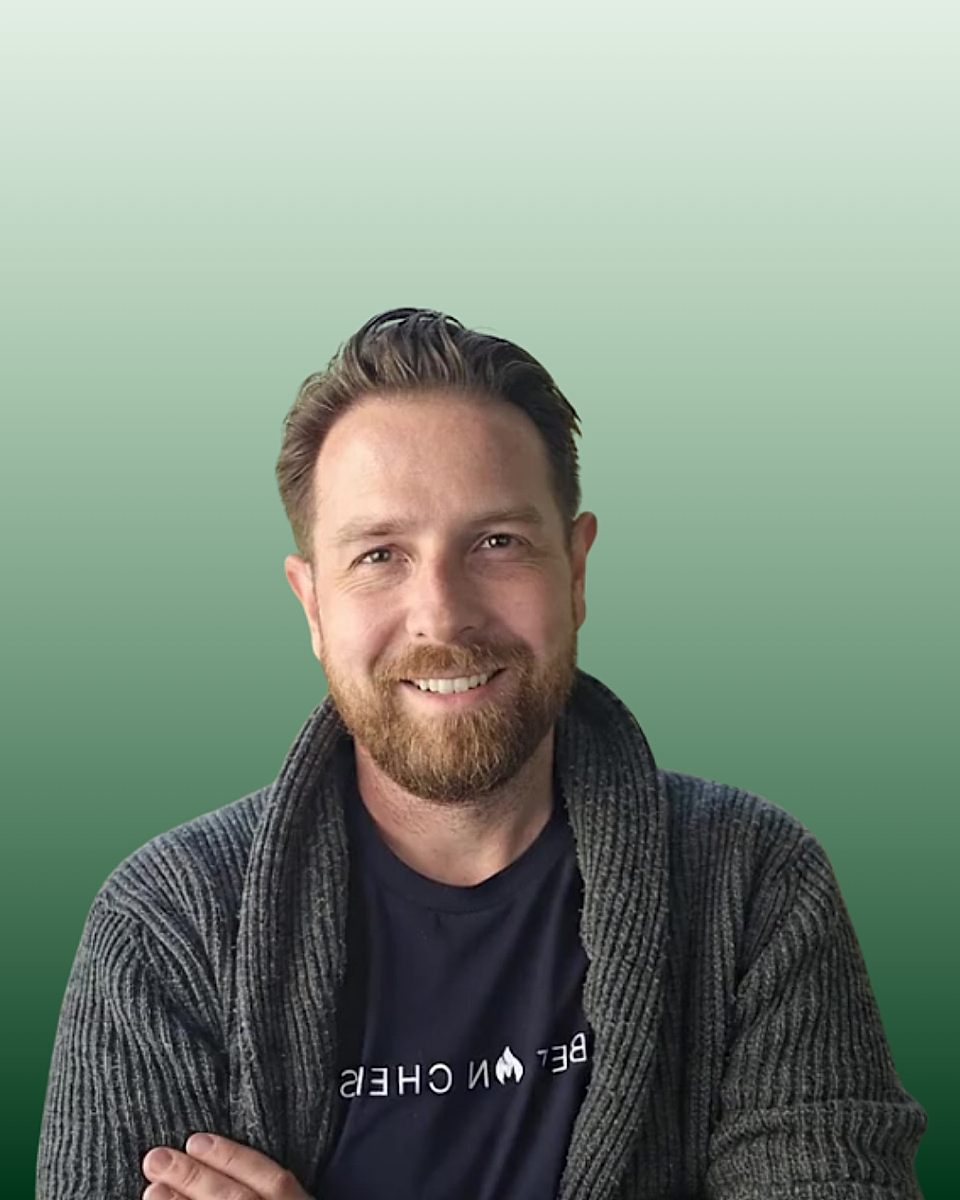 Portrait of a smiling man against a green gradient background